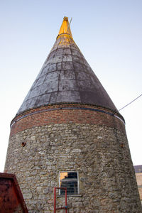 Low angle view of old building against sky