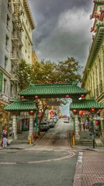 City street against cloudy sky