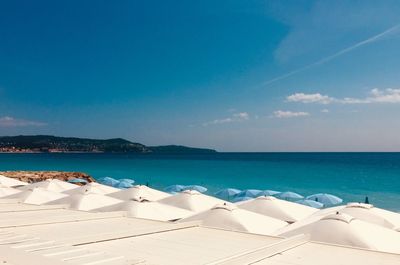 Scenic view of sea against blue sky