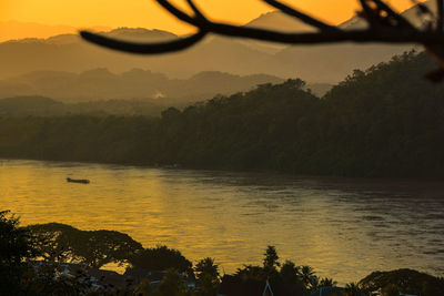 Scenic view of lake against sky during sunset