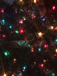 Illuminated christmas tree at night