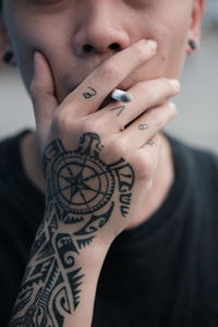 Midsection of hipster man smoking cigarette