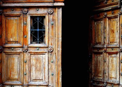 Old wooden ajar door