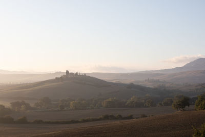 Scenic view of landscape against sky during sunset