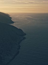 Scenic view of sea against sky at sunset