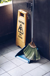 High angle view of cleaning equipment on tiled floor