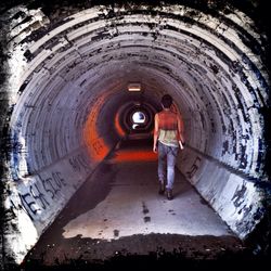 People walking in tunnel