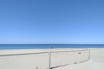 Scenic view of sea against clear blue sky