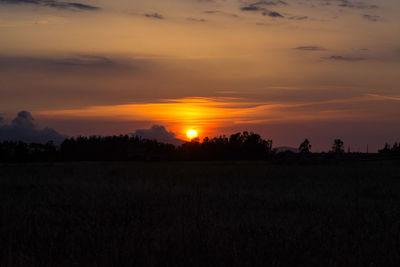 Scenic view of landscape at sunset