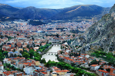 High angle view of river amidst buildings in town