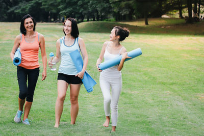 Full length of women standing on grass