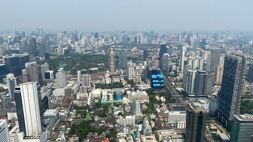 High angle view of modern buildings in city against sky