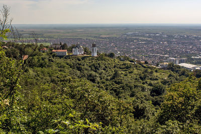 High angle view of trees and buildings against sky