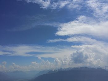 Low angle view of clouds over mountain