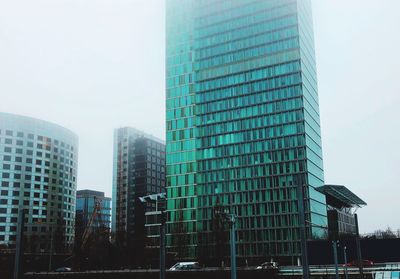 Low angle view of skyscrapers against clear sky