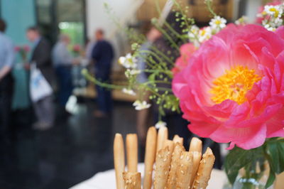 Close-up of pink rose flower on table