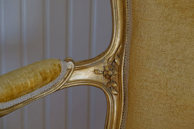 Cropped image of golden chair