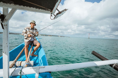 Low angle view of man in boat