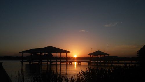 Silhouette of pier at sunset