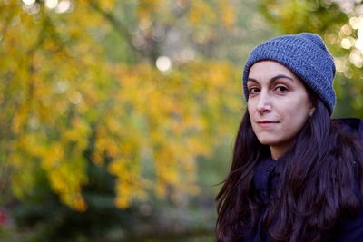 Portrait of young woman in autumn