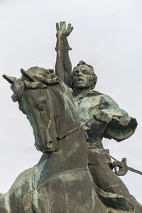 Low angle view of statue against sky