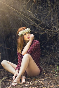 Portrait of young woman in forest