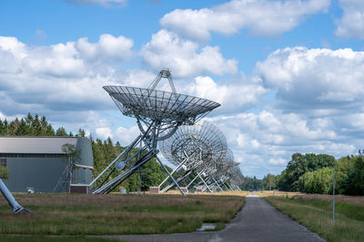 Tilt image of communications tower against sky