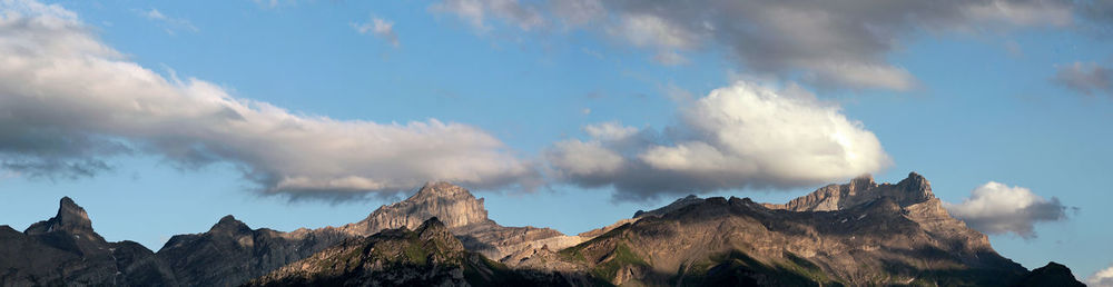 Low angle view of rock formations against sky