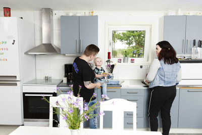 Women with toddler in kitchen