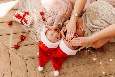 High angle view of mother and daughter on floor