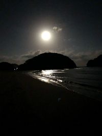 Scenic view of sea against sky at night