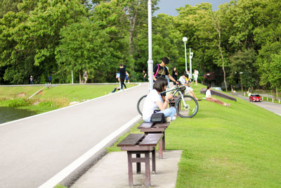 People riding motorcycle in park