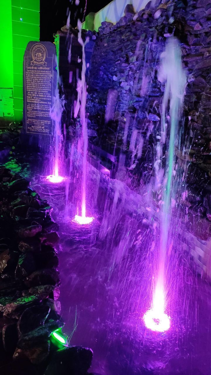 DIGITAL COMPOSITE IMAGE OF ILLUMINATED LIGHT WITH WATER FOUNTAIN