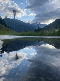 Scenic view of lake and mountains against sky