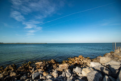 Scenic view of sea against blue sky