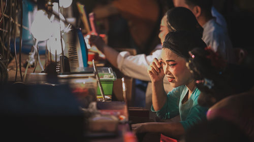 Senior woman getting ready during performance