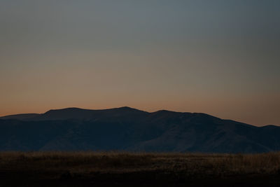 Scenic view of mountains against sky during sunset