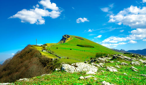 Landscape of rock mountain. hill with beautiful sky and white clouds on sunny day. farming ranch. 