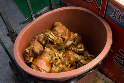 High angle view of cooked trotters in container for sale at namdaemun market