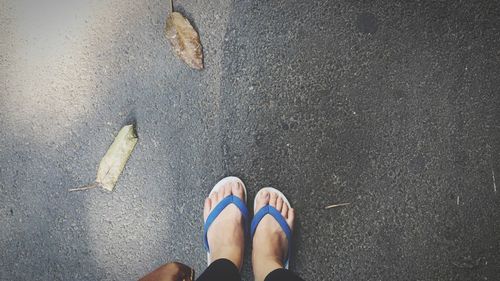 Low section of person standing on street