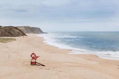 Scenic view of beach against sky