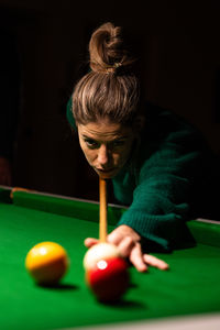 Boy playing pool