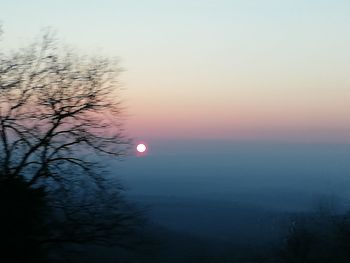 Scenic view of silhouette mountain against sky during sunset