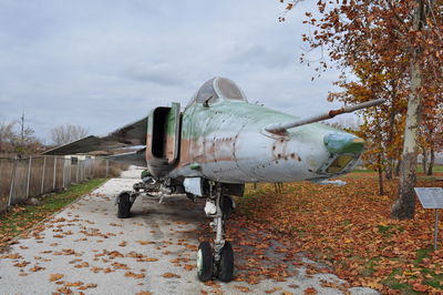 Abandoned airplane against sky