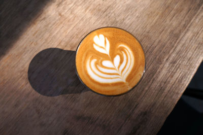 High angle view of coffee latte on table