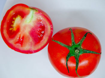 Directly above shot of tomatoes on white background