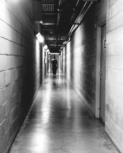 Woman walking in tunnel