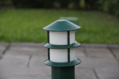 Close-up of empty bench in park