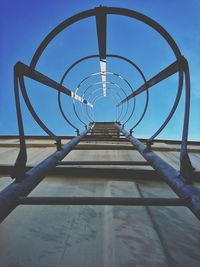 Directly below shot of metallic structure against sky