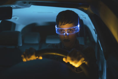 Woman wearing smart glasses driving car